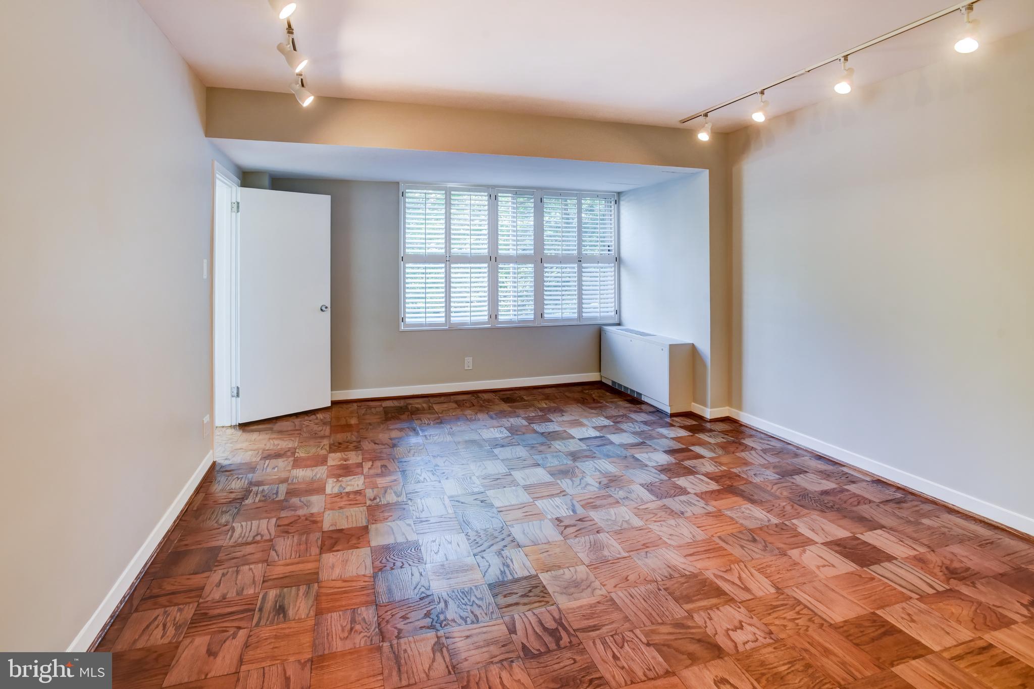 4100 Cathedral Avenue Northwest, Unit 512 Washington, DC 20016 - Photo 35 of 71 a view of an empty room and window