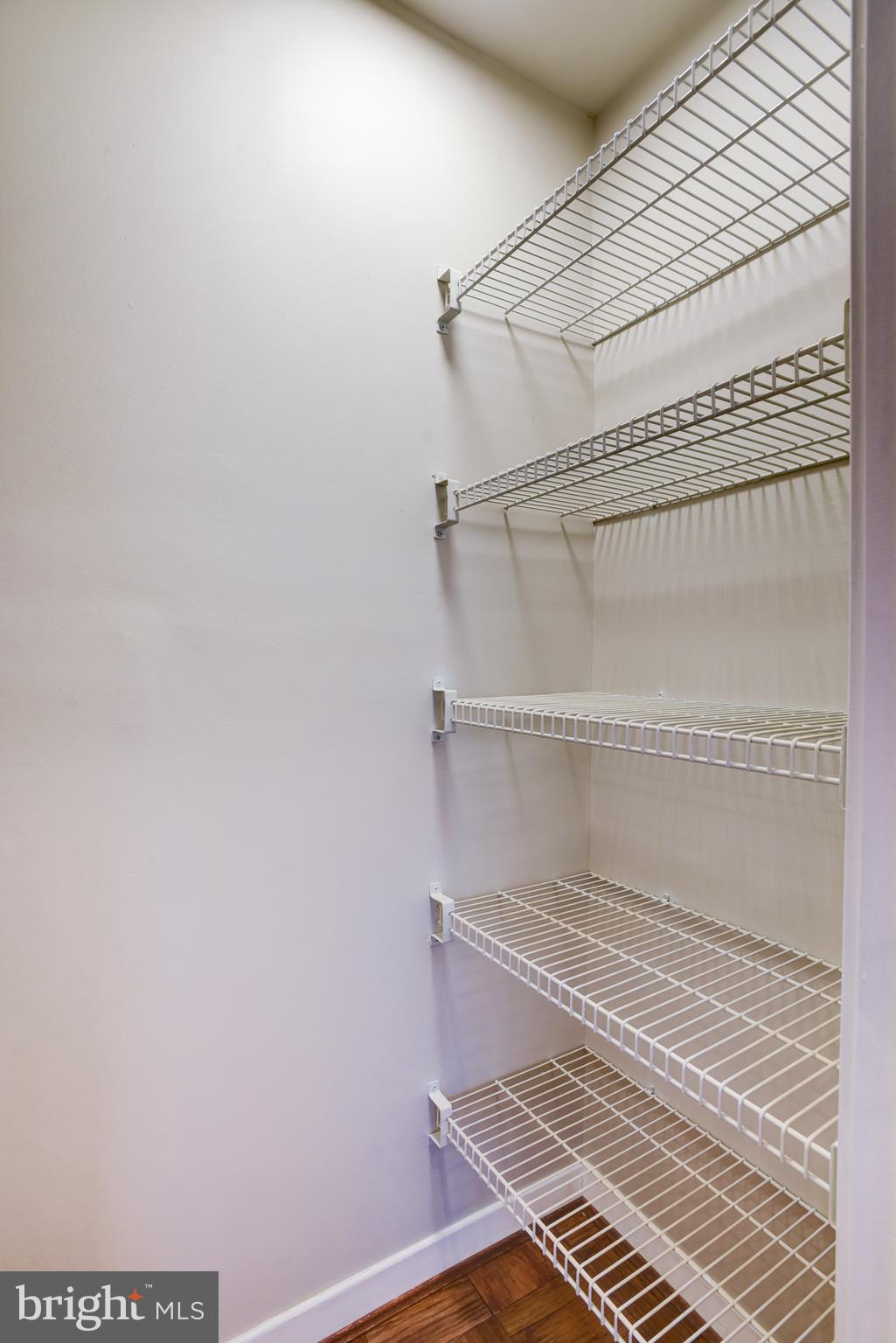 4100 Cathedral Avenue Northwest, Unit 512 Washington, DC 20016 - Photo 36 of 71 a view of a room with racks on the wall