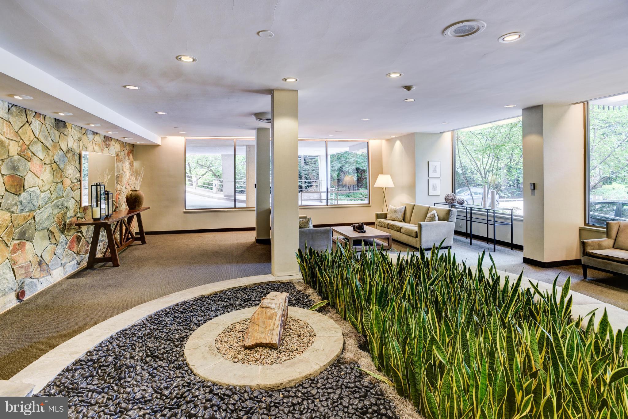 4100 Cathedral Avenue Northwest, Unit 512 Washington, DC 20016 - Photo 4 of 71 a living room with a large window