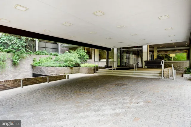 a large room with pool table table and chairs