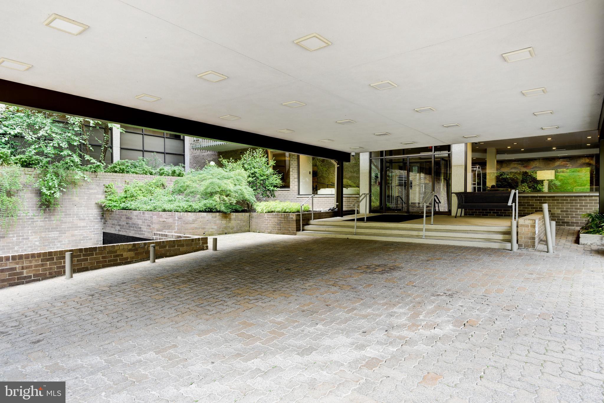4100 Cathedral Avenue Northwest, Unit 512 Washington, DC 20016 - Photo 47 of 71 a living room with furniture and a large window