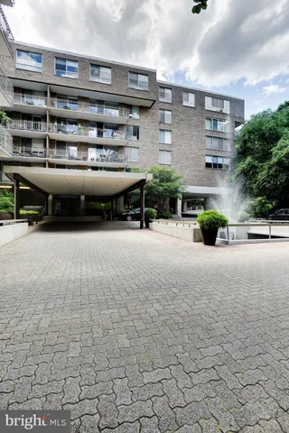 a view of parking garage with cars