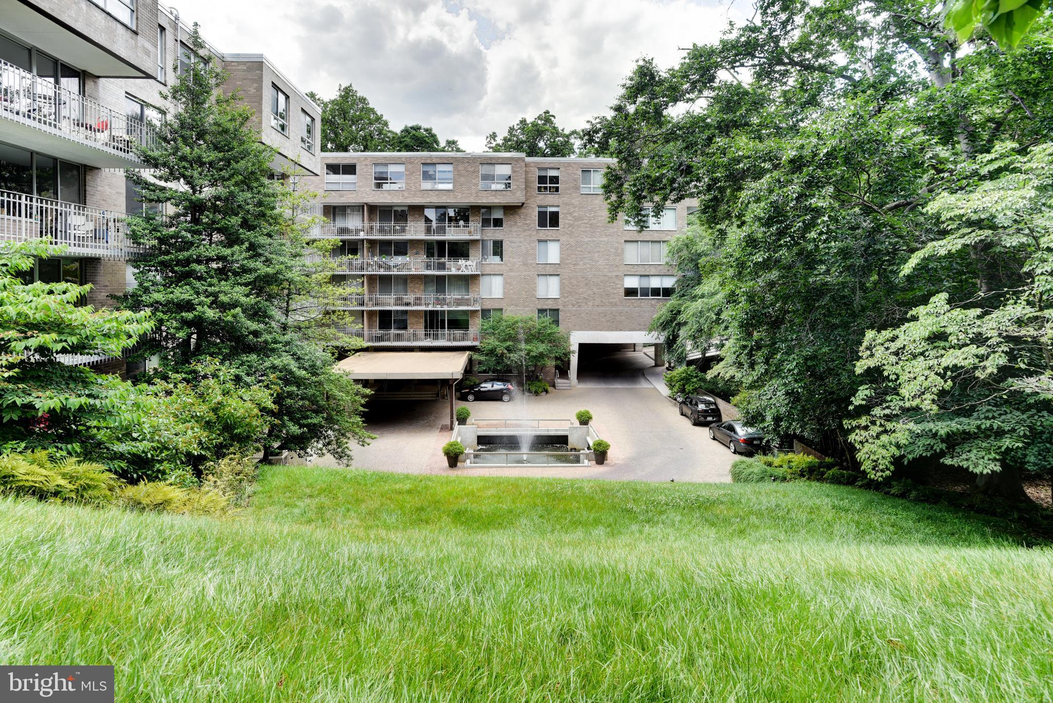 4100 Cathedral Avenue Northwest, Unit 512 Washington, DC 20016 - Photo 54 of 71 a white house with a yard and plants