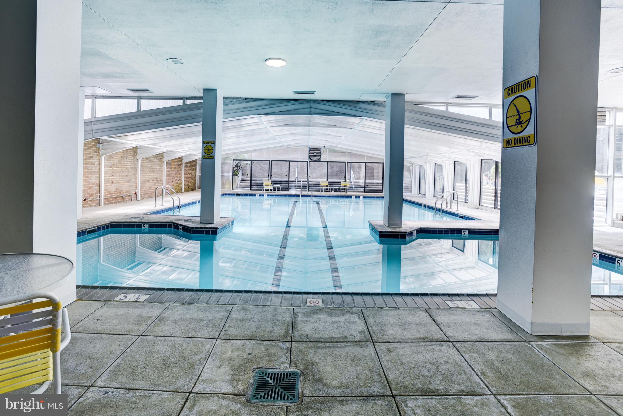 4100 Cathedral Avenue Northwest, Unit 512 Washington, DC 20016 - Photo 62 of 71 a view of kitchen with granite countertop a rug a stove and a view of living room