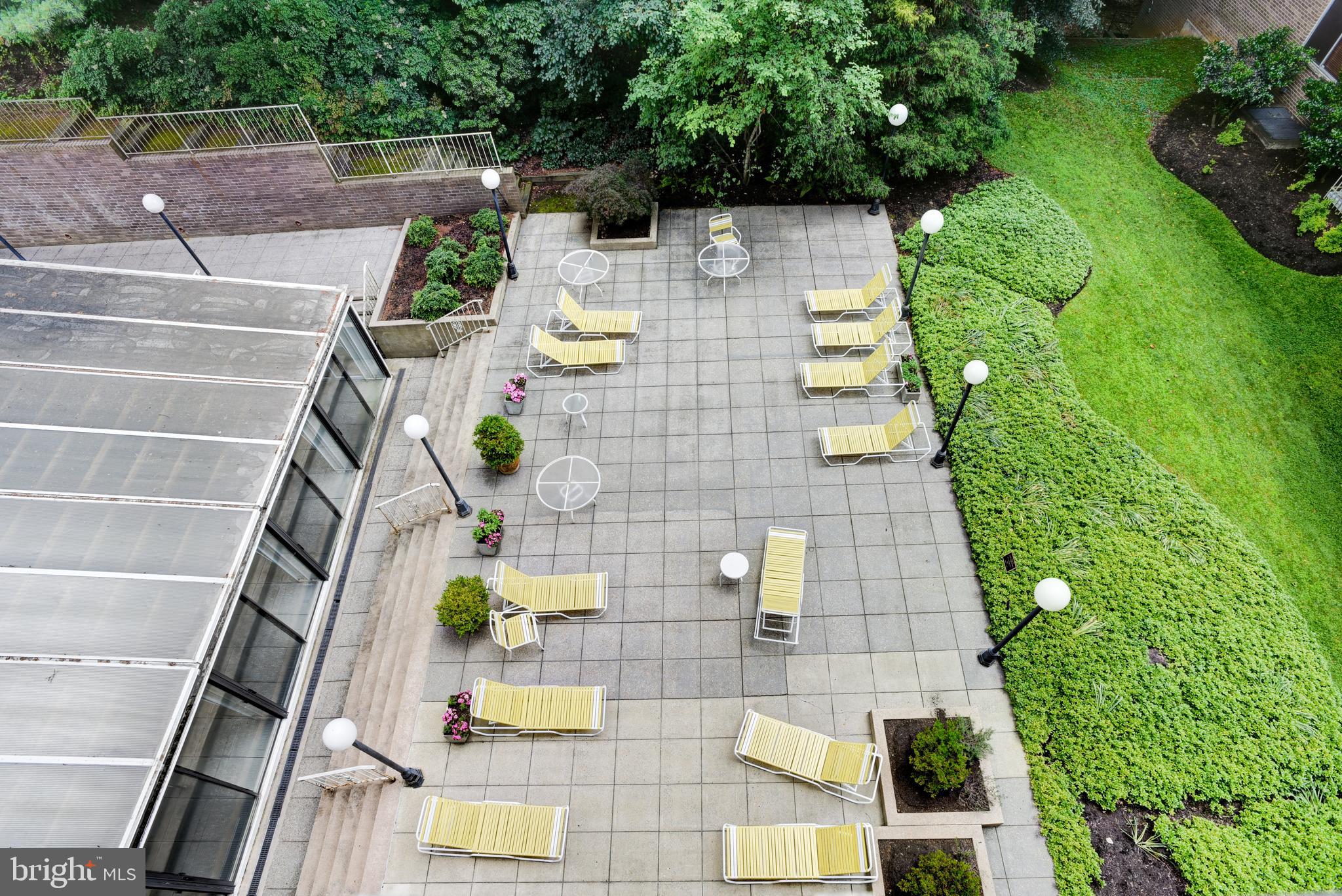 4100 Cathedral Avenue Northwest, Unit 512 Washington, DC 20016 - Photo 64 of 71 a backyard of a house with outdoor seating