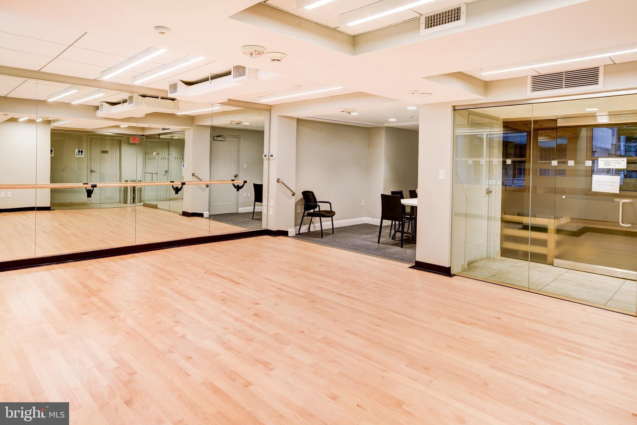4100 Cathedral Avenue Northwest, Unit 512 Washington, DC 20016 - Photo 66 of 71 a large room with pool table table and chairs