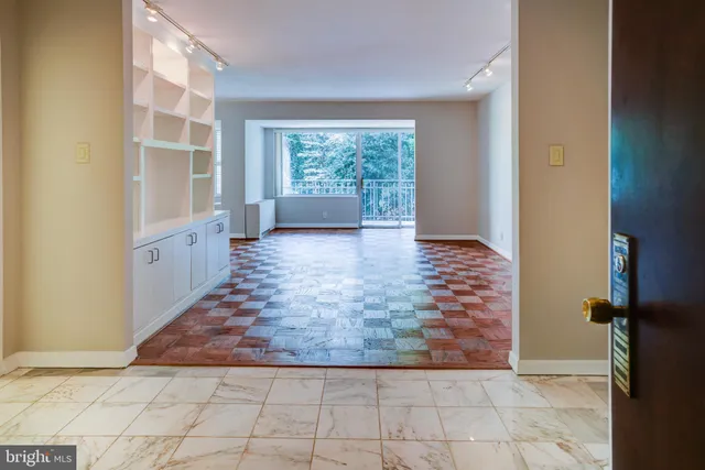 a view of an empty room with a window