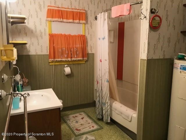 738 Myo Beach Road Meshoppen, PA 18630 - Photo 11 of 14 a bathroom with a window toilet and shower