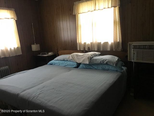 738 Myo Beach Road Meshoppen, PA 18630 - Photo 12 of 14 a bedroom with a bed and a window