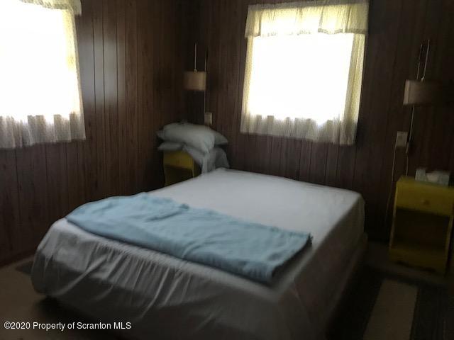 738 Myo Beach Road Meshoppen, PA 18630 - Photo 14 of 14 a bedroom with a bed and window