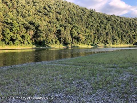 738 Myo Beach Road Meshoppen, PA 18630 - Photo 7 of 14 a view of a lake with a yard