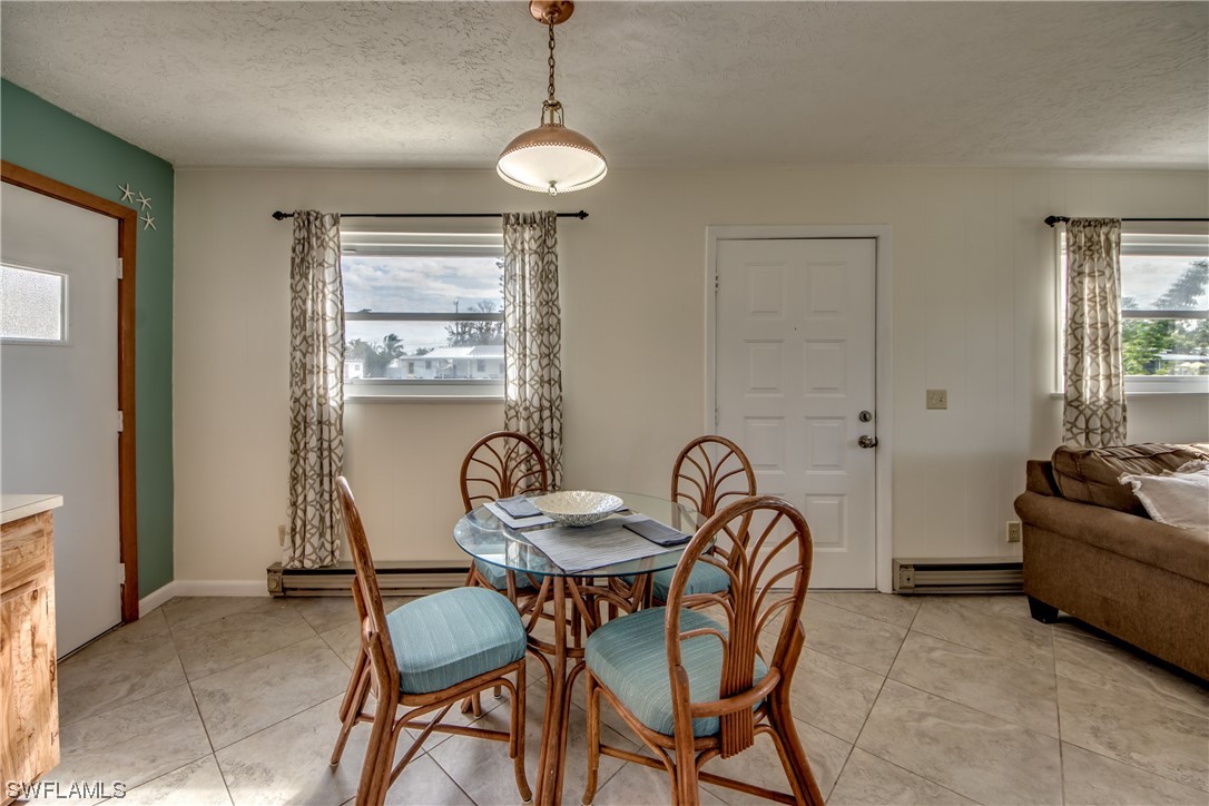 5892 Sailfish Road Bokeelia, FL 33922 - Photo 14 of 32 a view of a livingroom and dining room