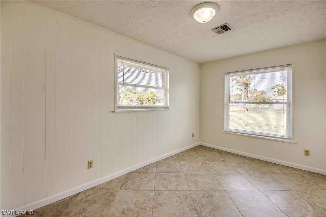 5892 Sailfish Road Bokeelia, FL 33922 - Photo 24 of 32 an empty room with windows and closet