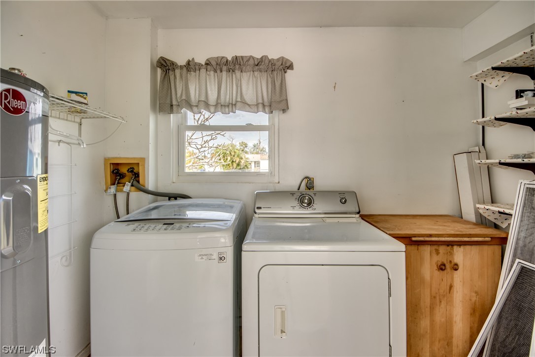 5892 Sailfish Road Bokeelia, FL 33922 - Photo 27 of 32 a utility room with dryer and washer