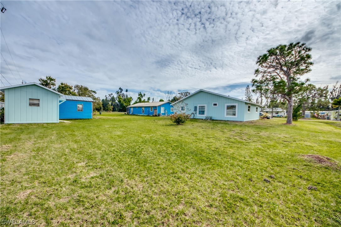 5892 Sailfish Road Bokeelia, FL 33922 - Photo 28 of 32 a view of a house with a yard