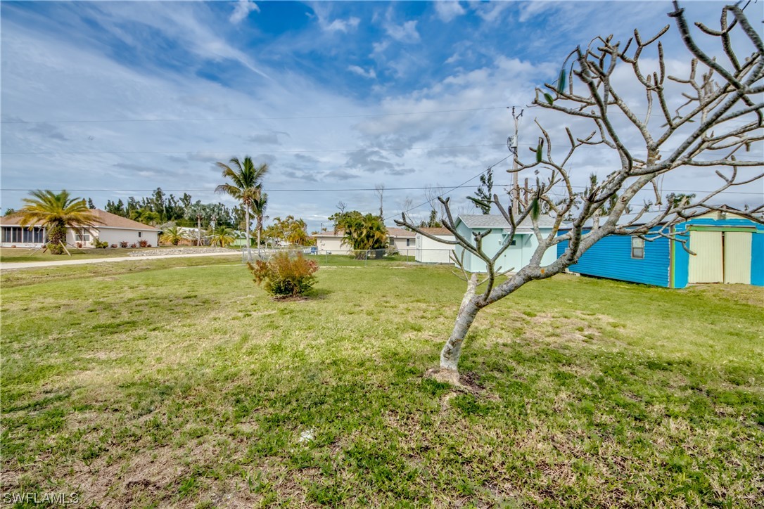 5892 Sailfish Road Bokeelia, FL 33922 - Photo 30 of 32 a view of a yard with an outdoor space