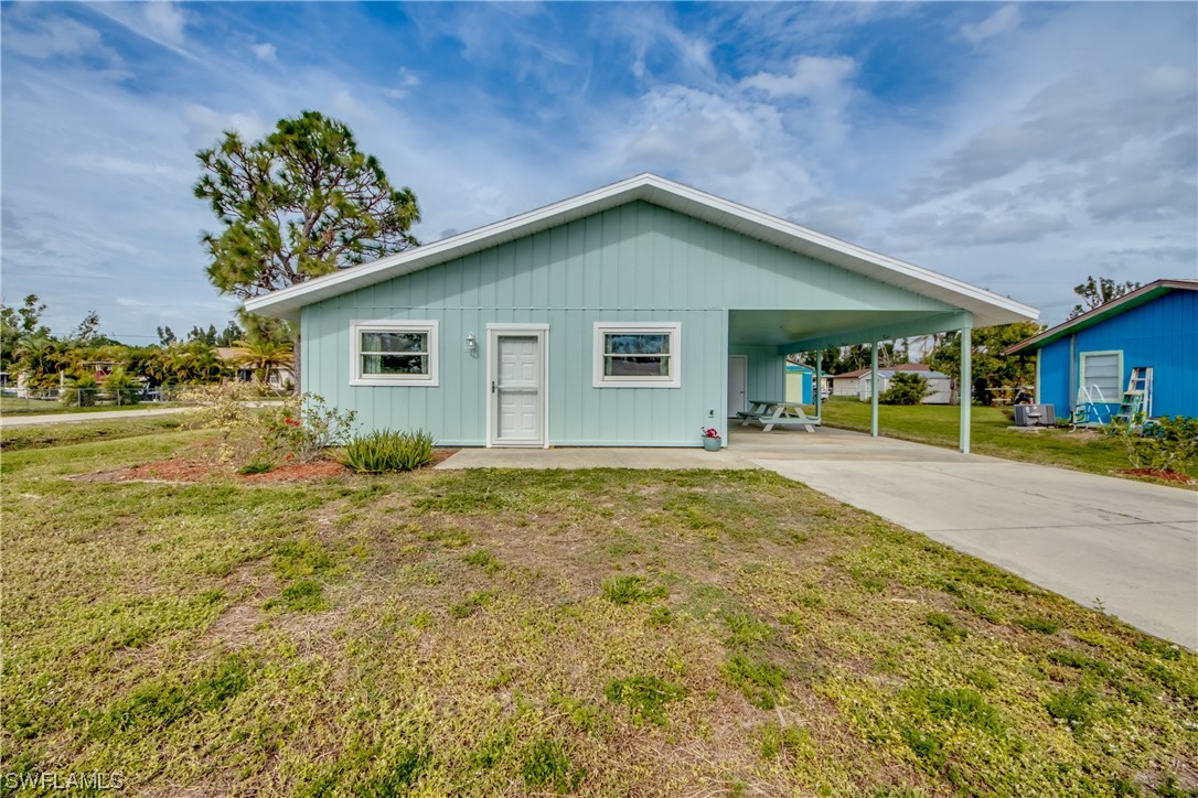 5892 Sailfish Road Bokeelia, FL 33922 - Photo 3 of 32 a house view with a garden space