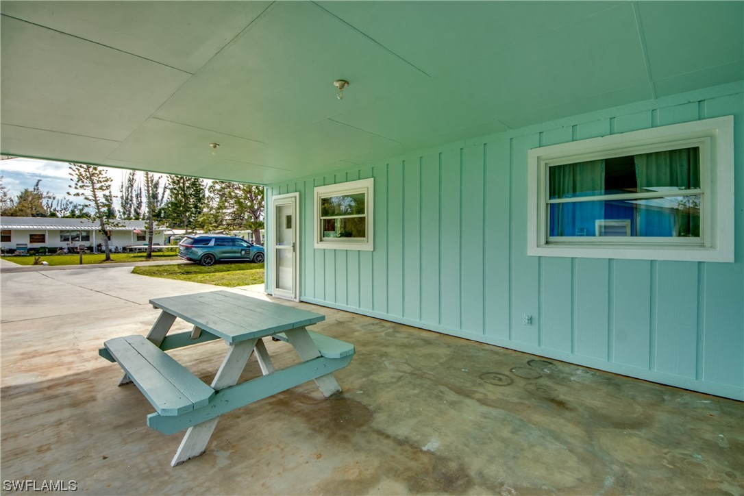 5892 Sailfish Road Bokeelia, FL 33922 - Photo 6 of 32 a view of swimming pool with outdoor seating