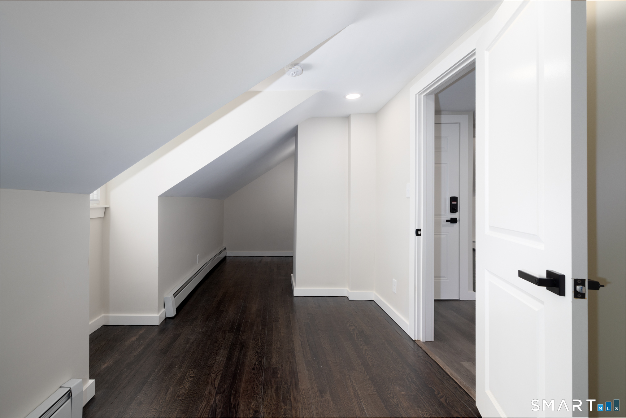 28 Aircraft Road, Unit I Southington, CT 06489 - Photo 15 of 18 a view of a hallway with wooden floor