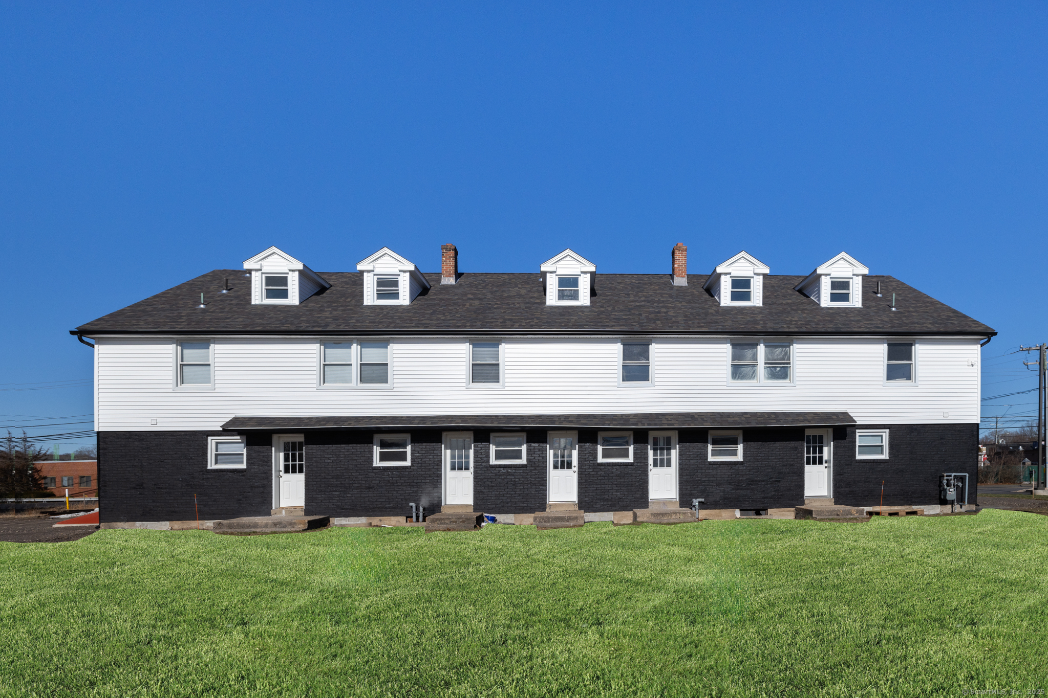 28 Aircraft Road, Unit I Southington, CT 06489 - Photo 17 of 18 a front view of a house with a yard