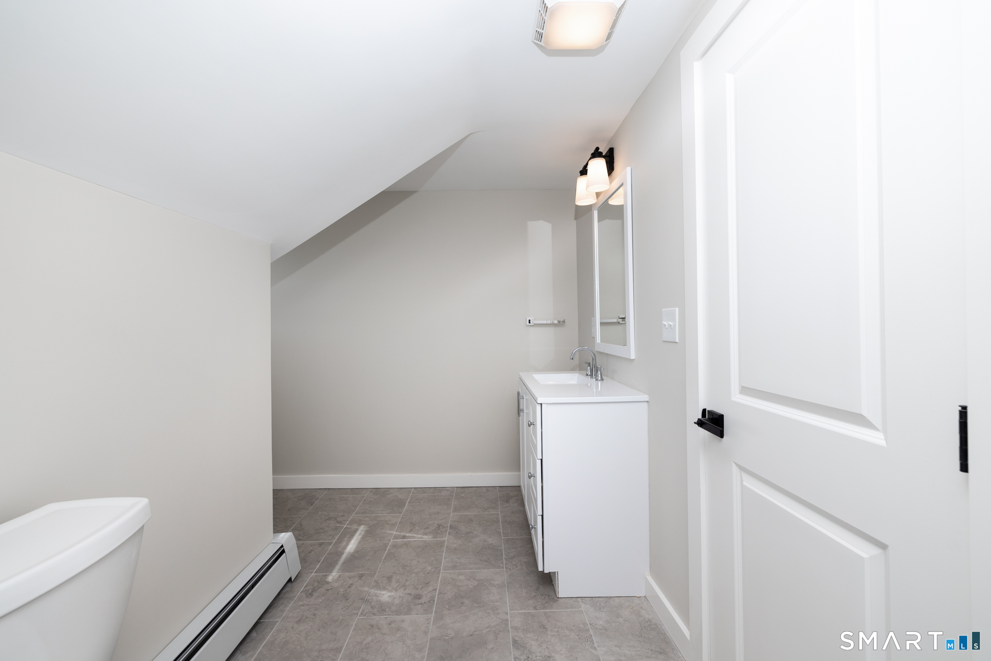 28 Aircraft Road, Unit I Southington, CT 06489 - Photo 8 of 18 a bathroom with a sink a toilet and shower