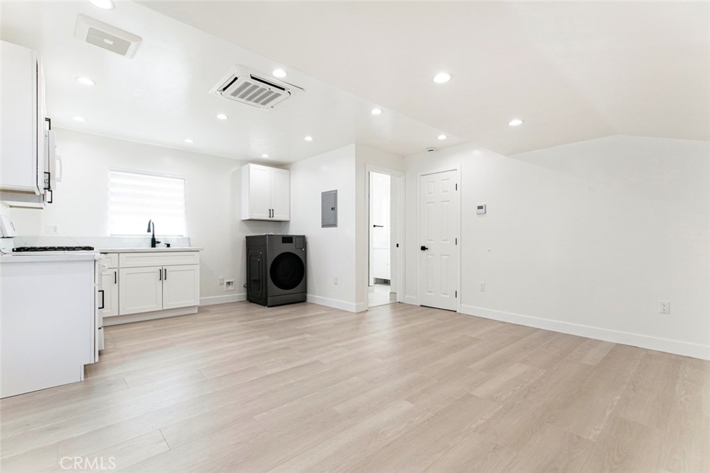 11321 Collett Avenue Granada Hills, CA 91344 - Photo 4 of 11 a view of a kitchen with a sink a refrigerator and window