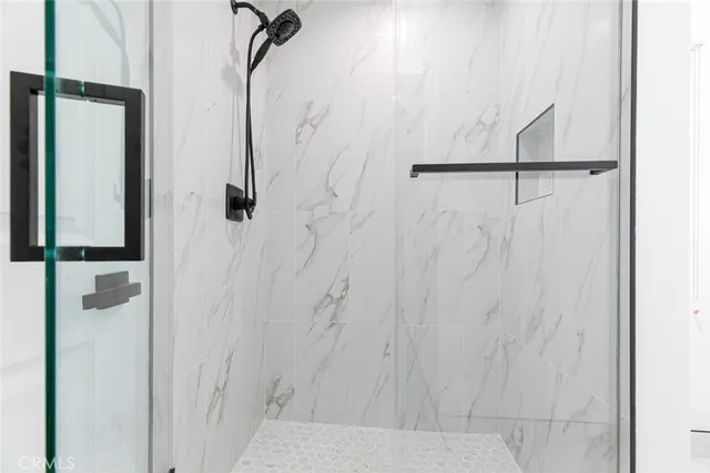 a white toilet sitting next to a bathroom sink