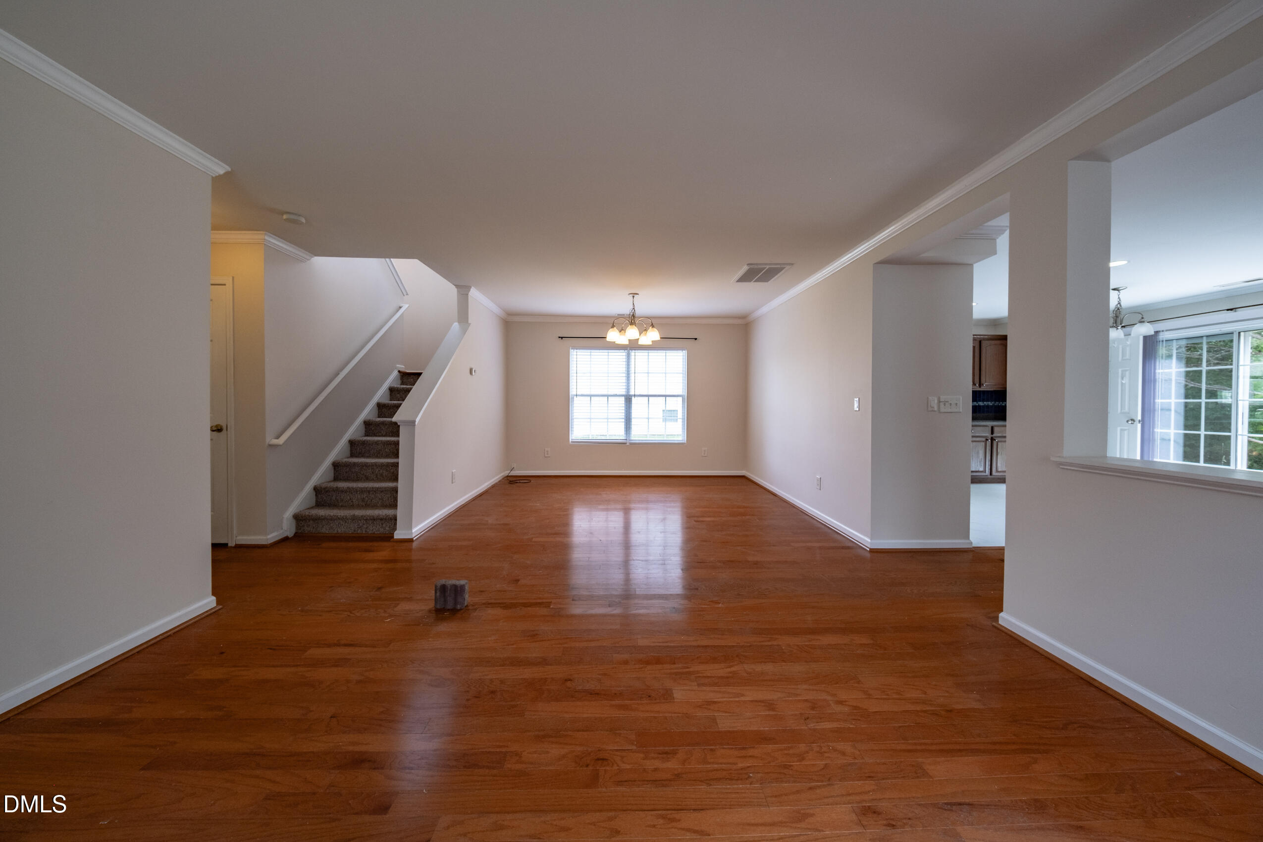 719 Obsidian Way Durham, NC 27703 - Photo 6 of 41 wooden floor in an empty room with a window