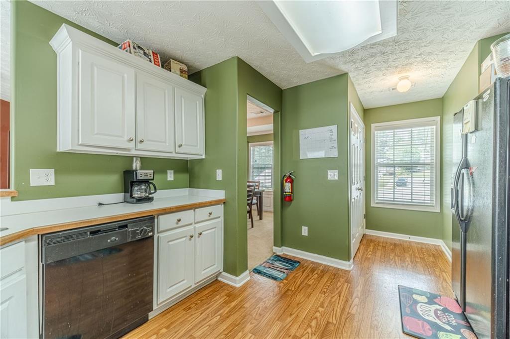 1185 Wendy Way Winder, GA 30680 - Photo 13 of 46 a spacious bathroom with a sink mirror and a shower
