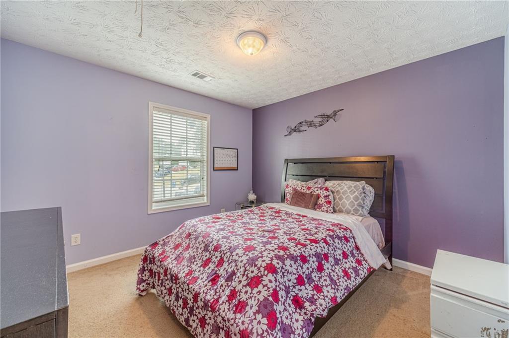 1185 Wendy Way Winder, GA 30680 - Photo 21 of 46 a bedroom with a bed and a window