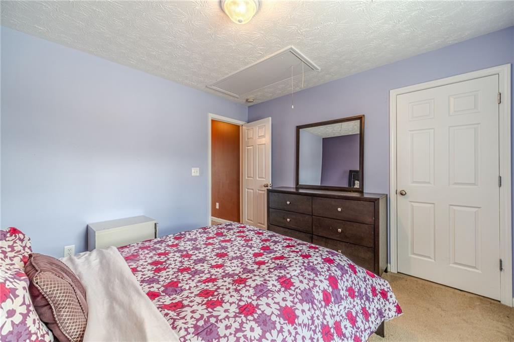 1185 Wendy Way Winder, GA 30680 - Photo 22 of 46 a bedroom with a bed and a closet