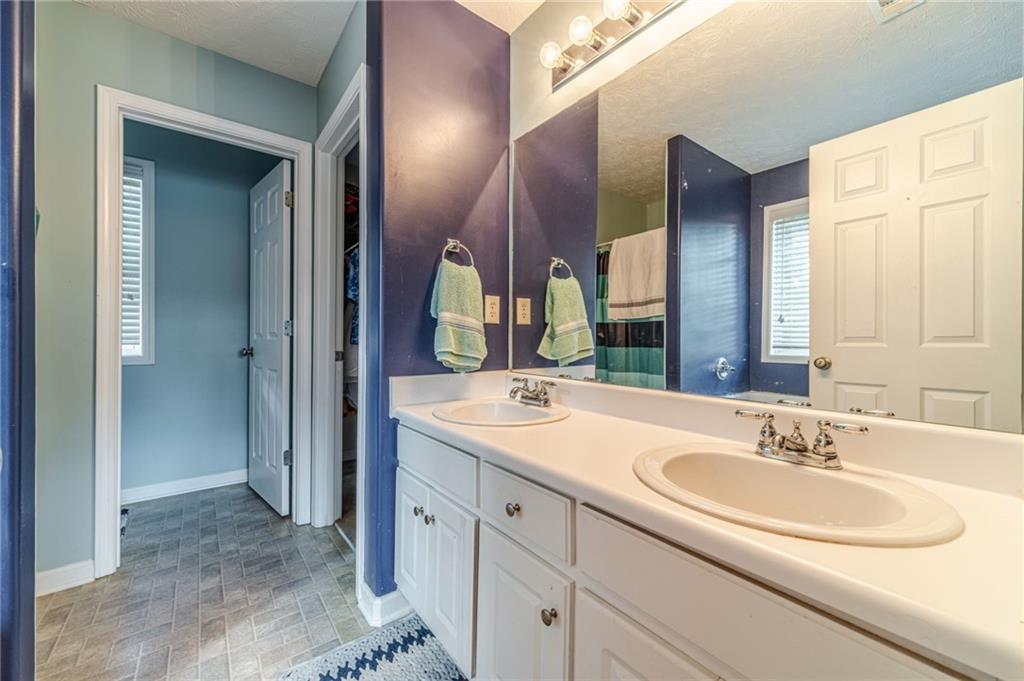 1185 Wendy Way Winder, GA 30680 - Photo 28 of 46 a bathroom with a sink and a mirror