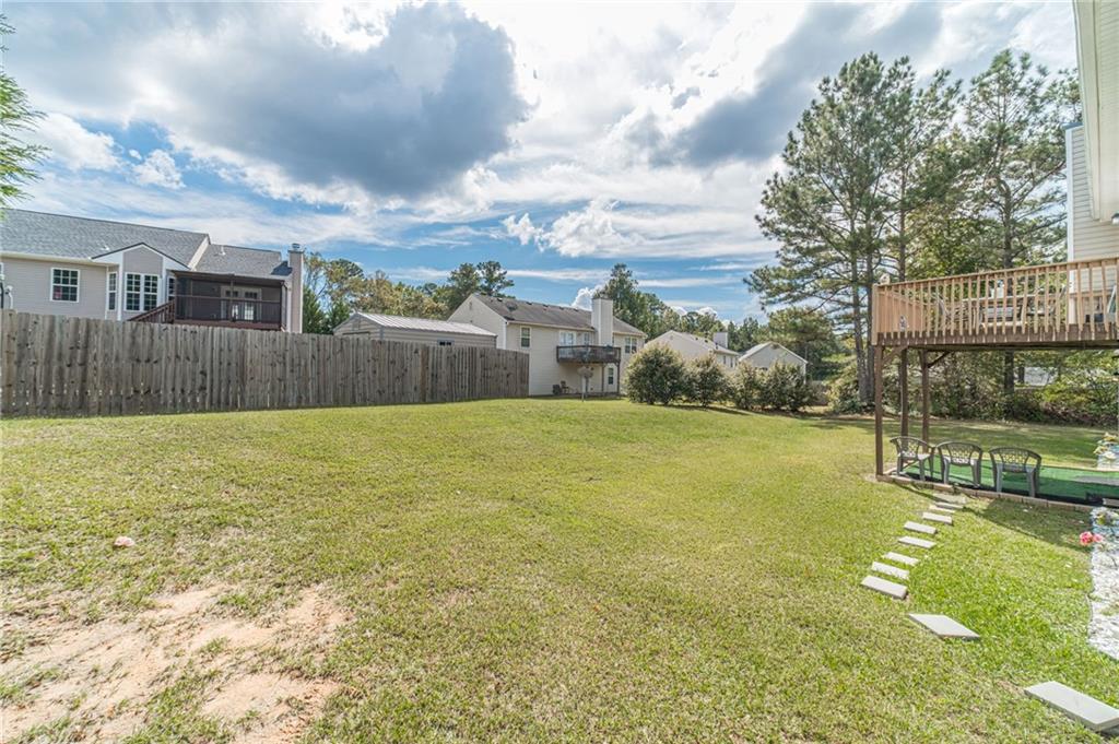1185 Wendy Way Winder, GA 30680 - Photo 42 of 46 a swimming pool with outdoor seating and yard