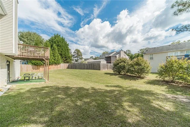 a view of a back yard of the house