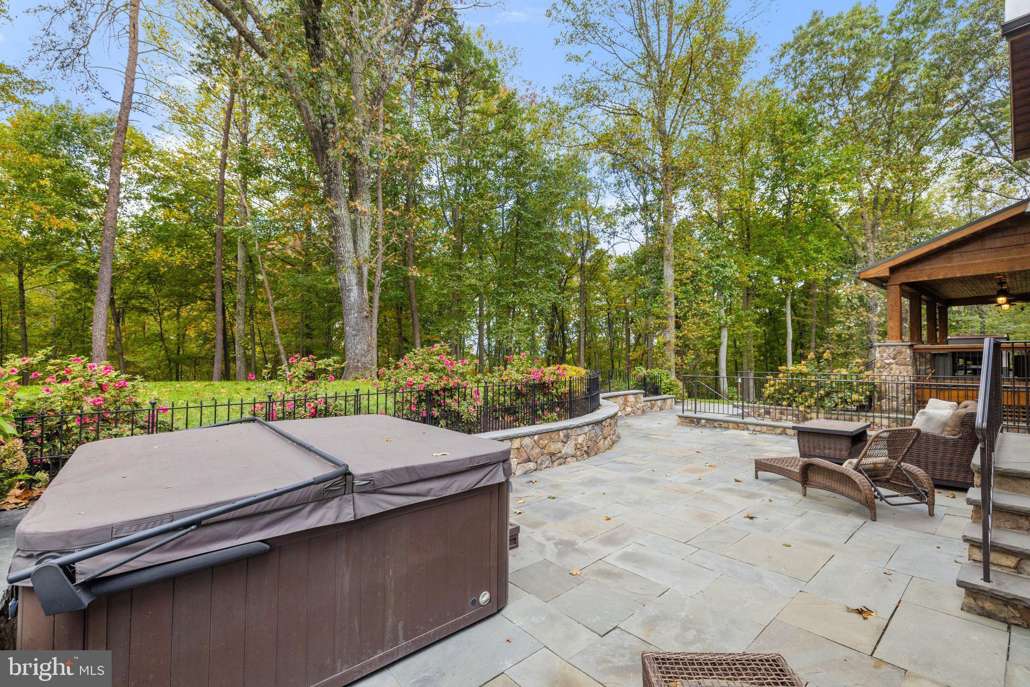 6416 Weadon Ridge Lane Marshall, VA 20115 - Photo 16 of 92 Custom Stone Patio with Hot Tub & Retaining Walls