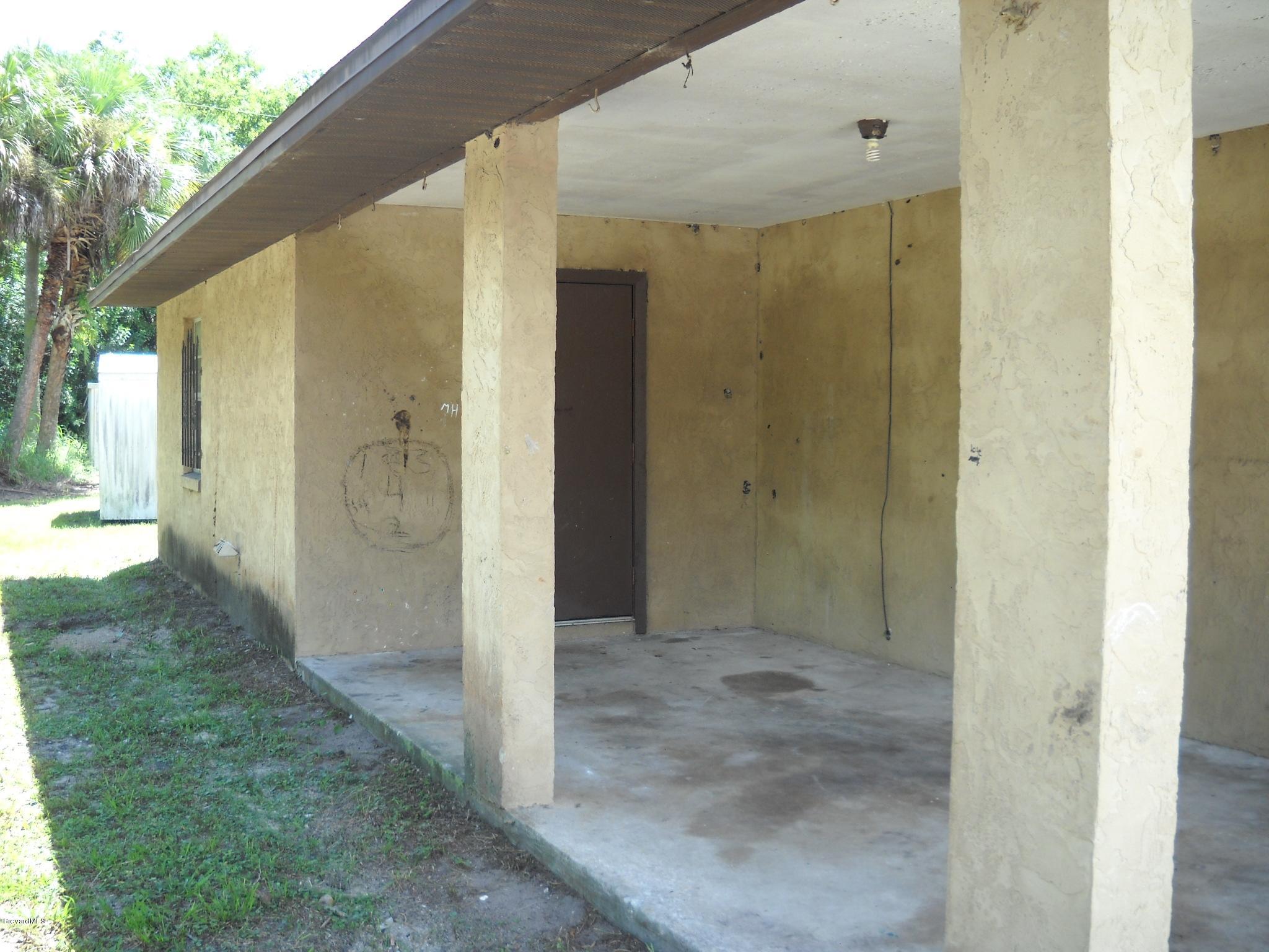 980 Santa Rosa Drive Rockledge, FL 32955 - Photo 15 of 15 Carport & Utility room view