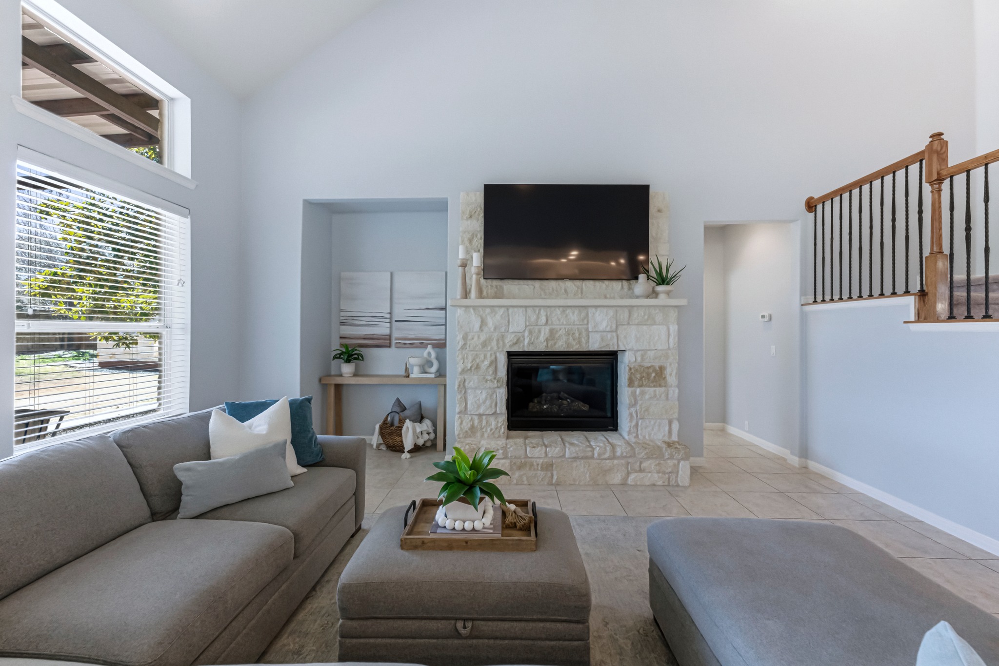 1023 Grassy Field Road Austin, TX 78737 - Photo 1 of 39 a living room with furniture a flat screen tv and a fireplace