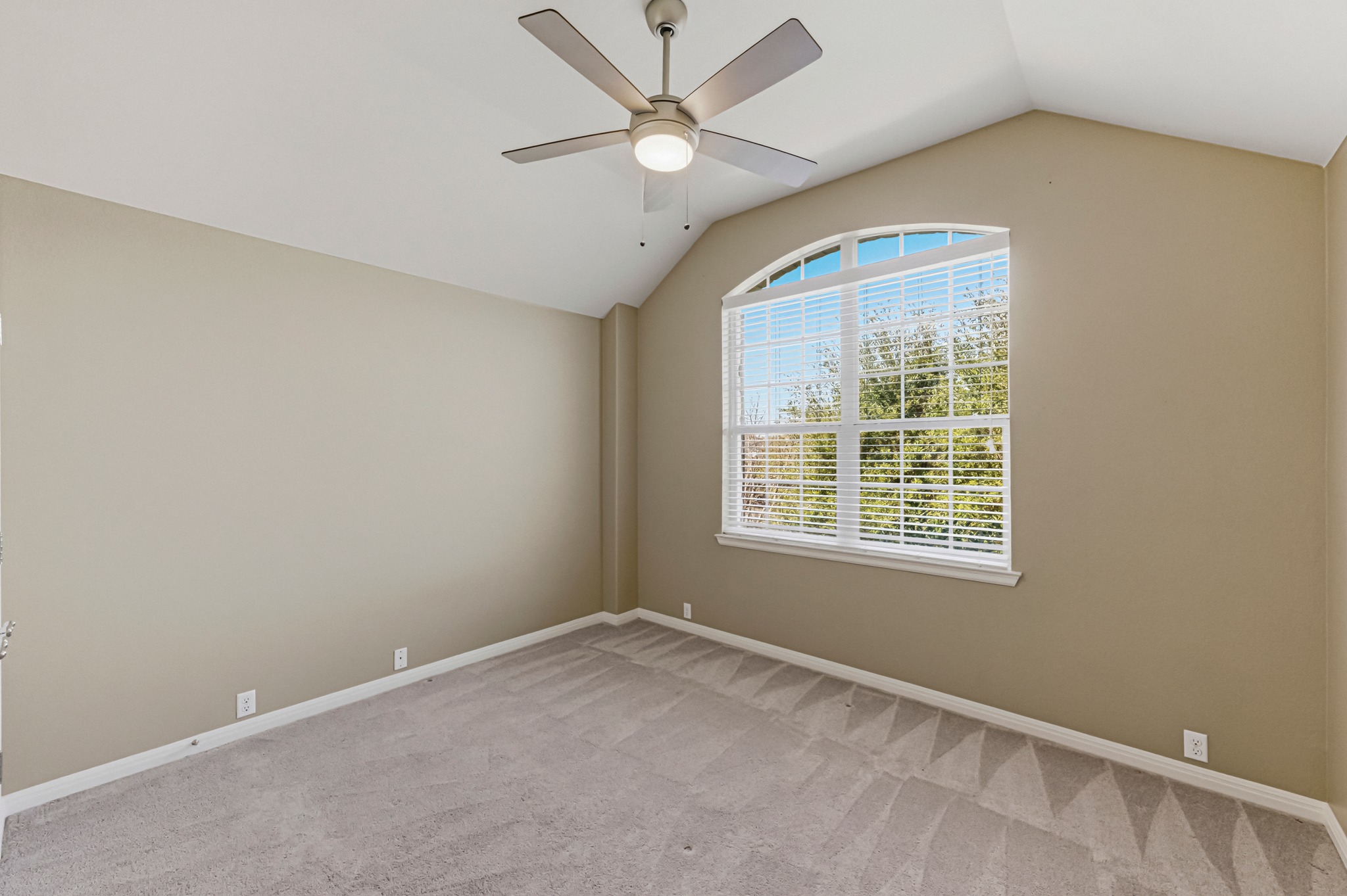 1023 Grassy Field Road Austin, TX 78737 - Photo 26 of 39 an empty room with a window and a fan