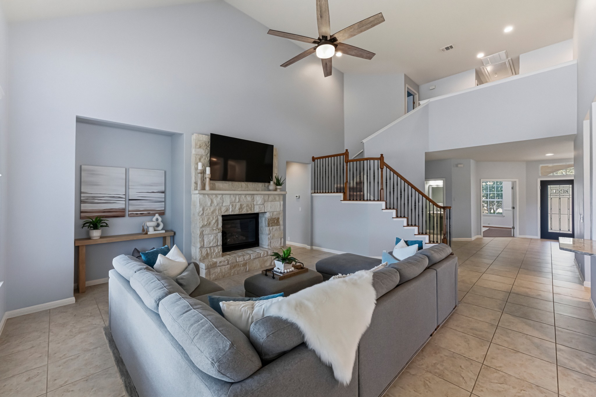 1023 Grassy Field Road Austin, TX 78737 - Photo 8 of 39 a living room with furniture a fireplace and a flat screen tv
