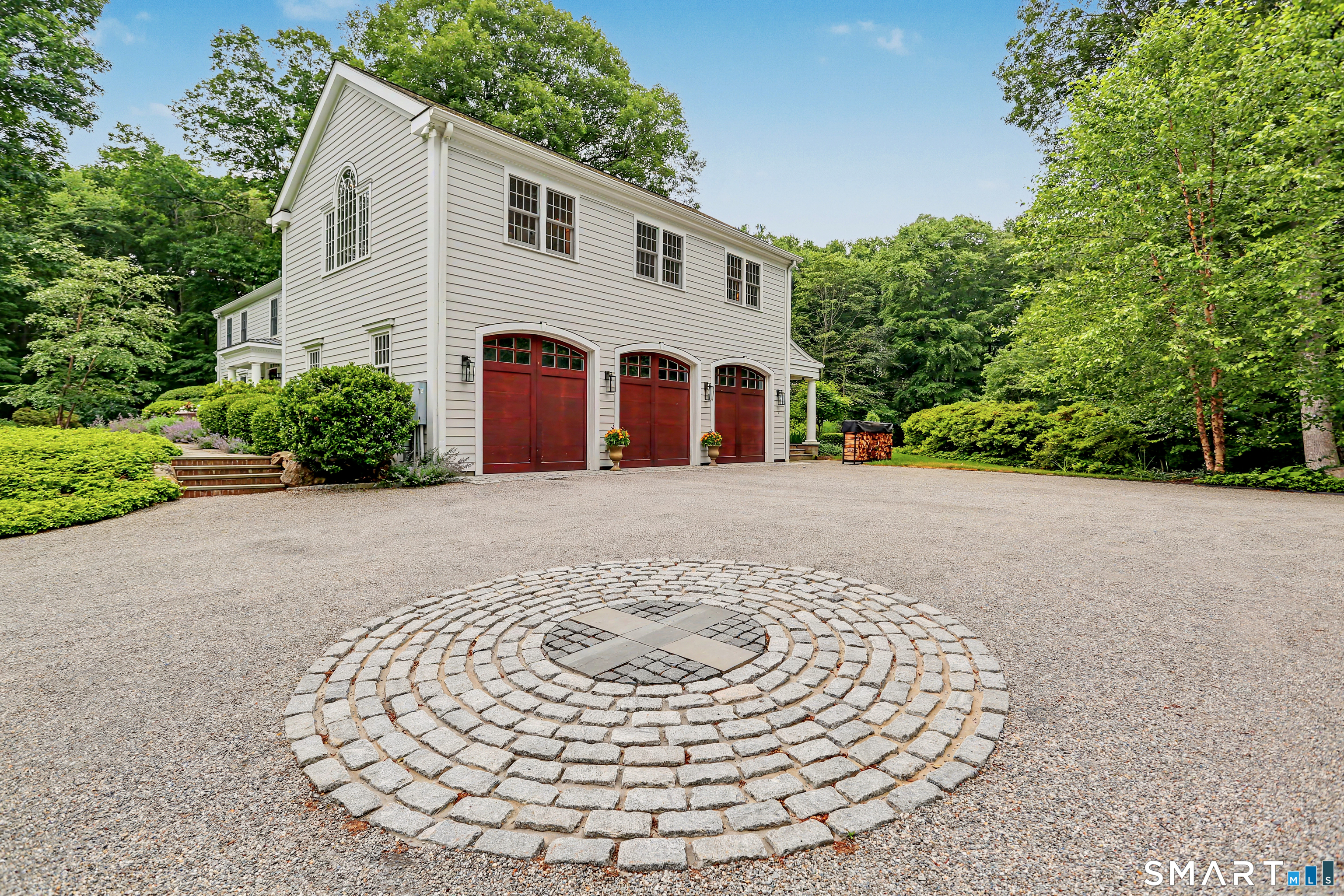 108 Logan Road New Canaan, CT 06840 - Photo 38 of 40 a view of a house with a yard
