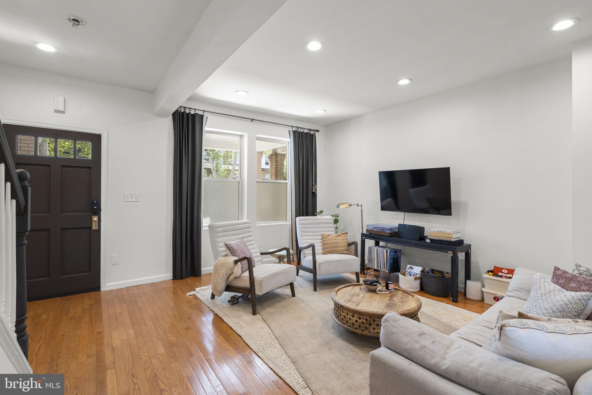 1712 M Street Northeast Washington, DC 20002 - Photo 11 of 38 a living room with furniture and a flat screen tv