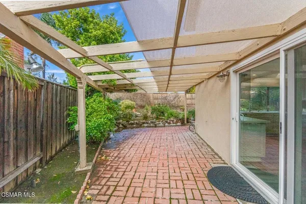 a view of a backyard with pathway