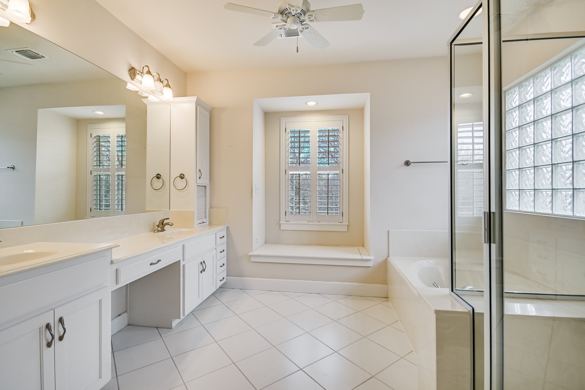 703 Pressler Street Austin, TX 78703 - Photo 15 of 24 a bathroom with a tub sink and mirror