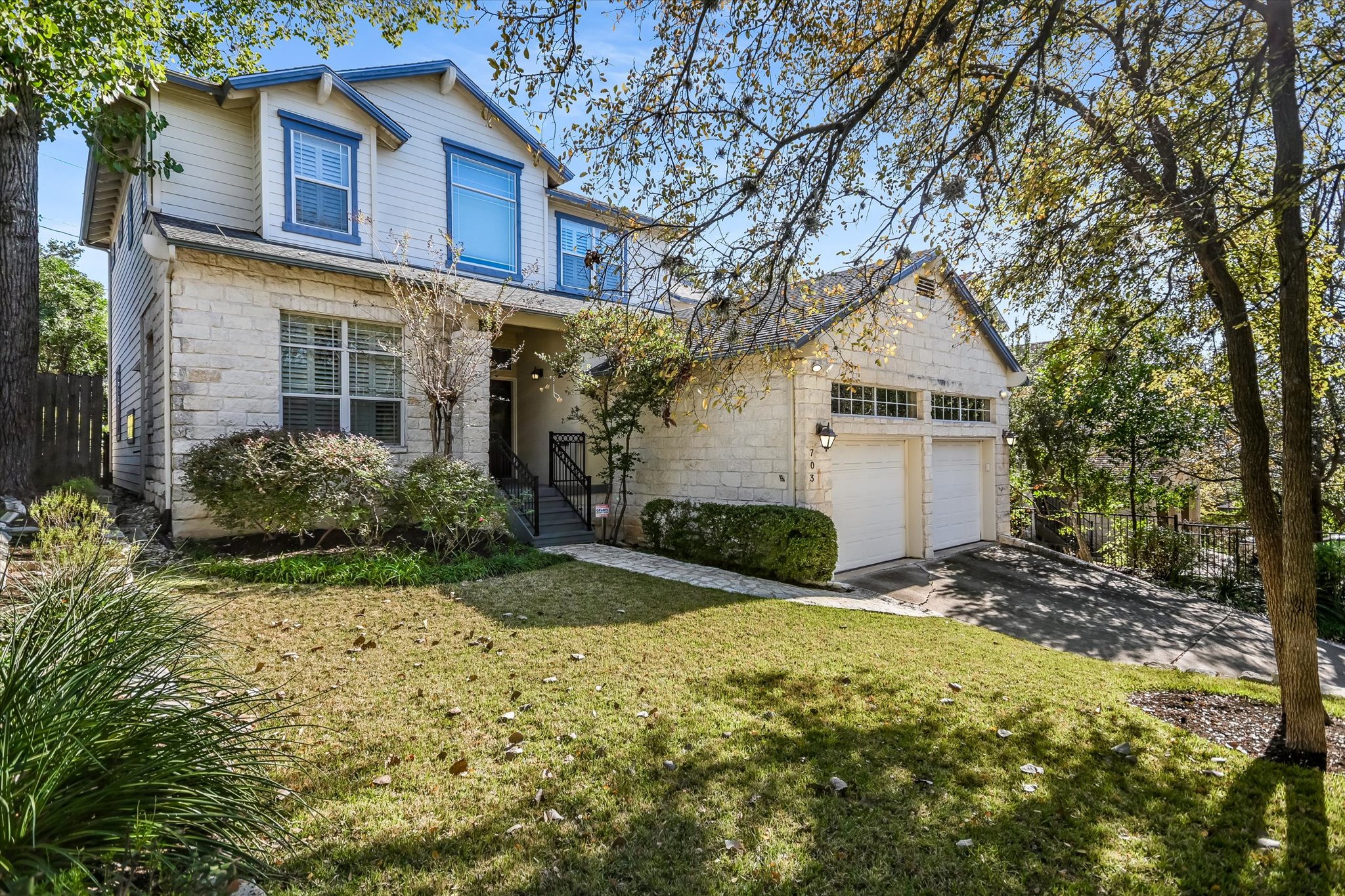 703 Pressler Street Austin, TX 78703 - Photo 2 of 24 a view of a yard in front of house