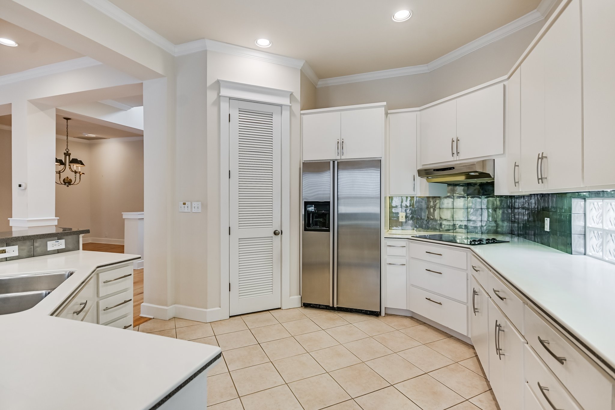 703 Pressler Street Austin, TX 78703 - Photo 9 of 24 a kitchen with stainless steel appliances a refrigerator sink and cabinets