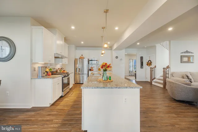 a view of a living room and kitchen