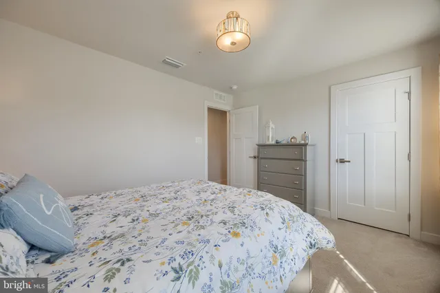 a bedroom with a bed and a cabinets