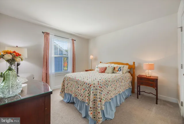 a bedroom with a bed and a table