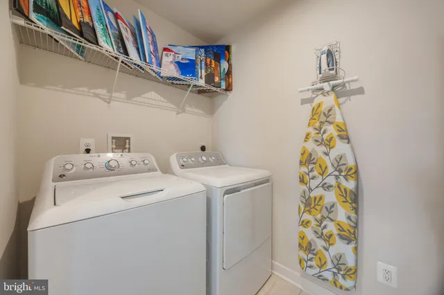 a living room with furniture and a chair