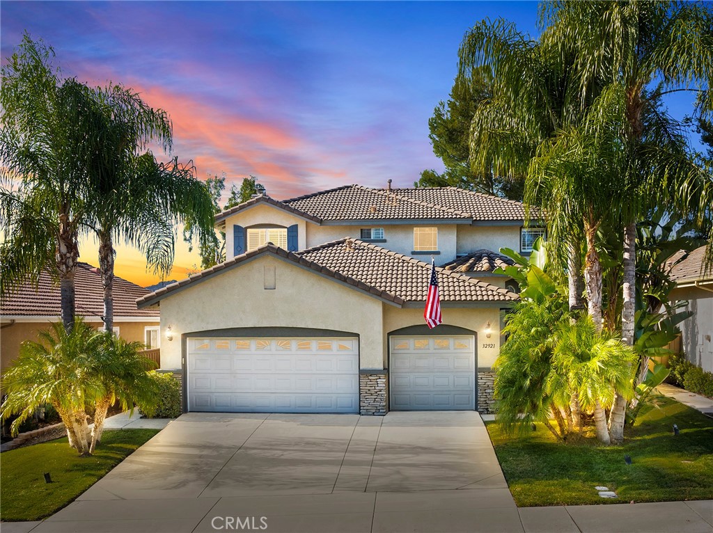32921 Adelante Street Temecula, CA 92592 - Photo 47 of 48 a front view of a house with a yard and garage